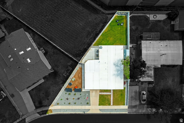 48 Moon Ridge Drive Murray, UT 84107 - Photo 28 of 30 Aerial property view featuring a flat roofline, distinct front yard landscaping with gravel and plantings, a concrete patio, and a manicured rear lawn