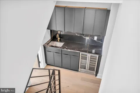 a kitchen with a sink and cabinets