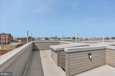 a view of balcony with outdoor seating and city view