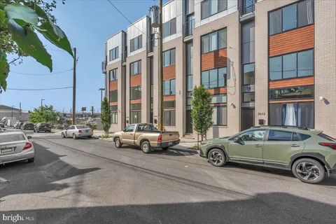 a view of a car parked in front of a buildings
