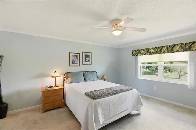 a bedroom with a bed and a night stand