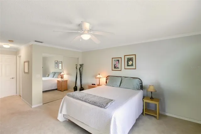 a bathroom with a sink mirror and a toilet
