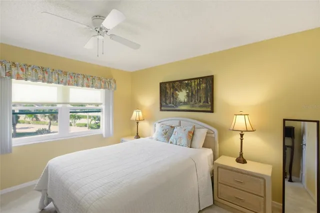 an aerial view of residential houses with outdoor space and swimming pool