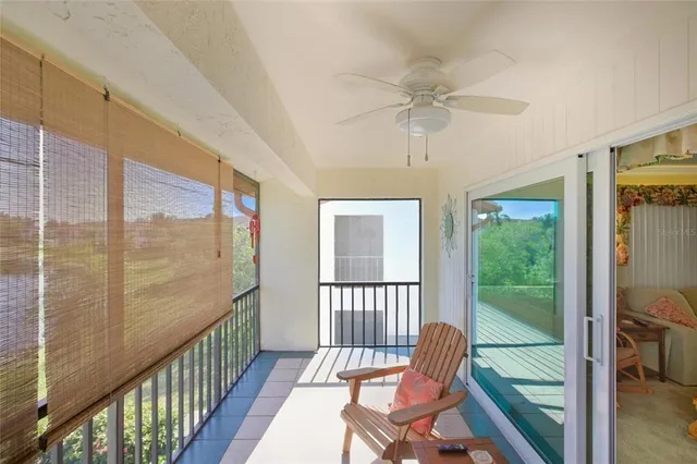 a view of a workspace with furniture and a flat screen tv