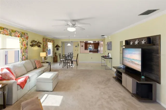 a view of a living room and dining room