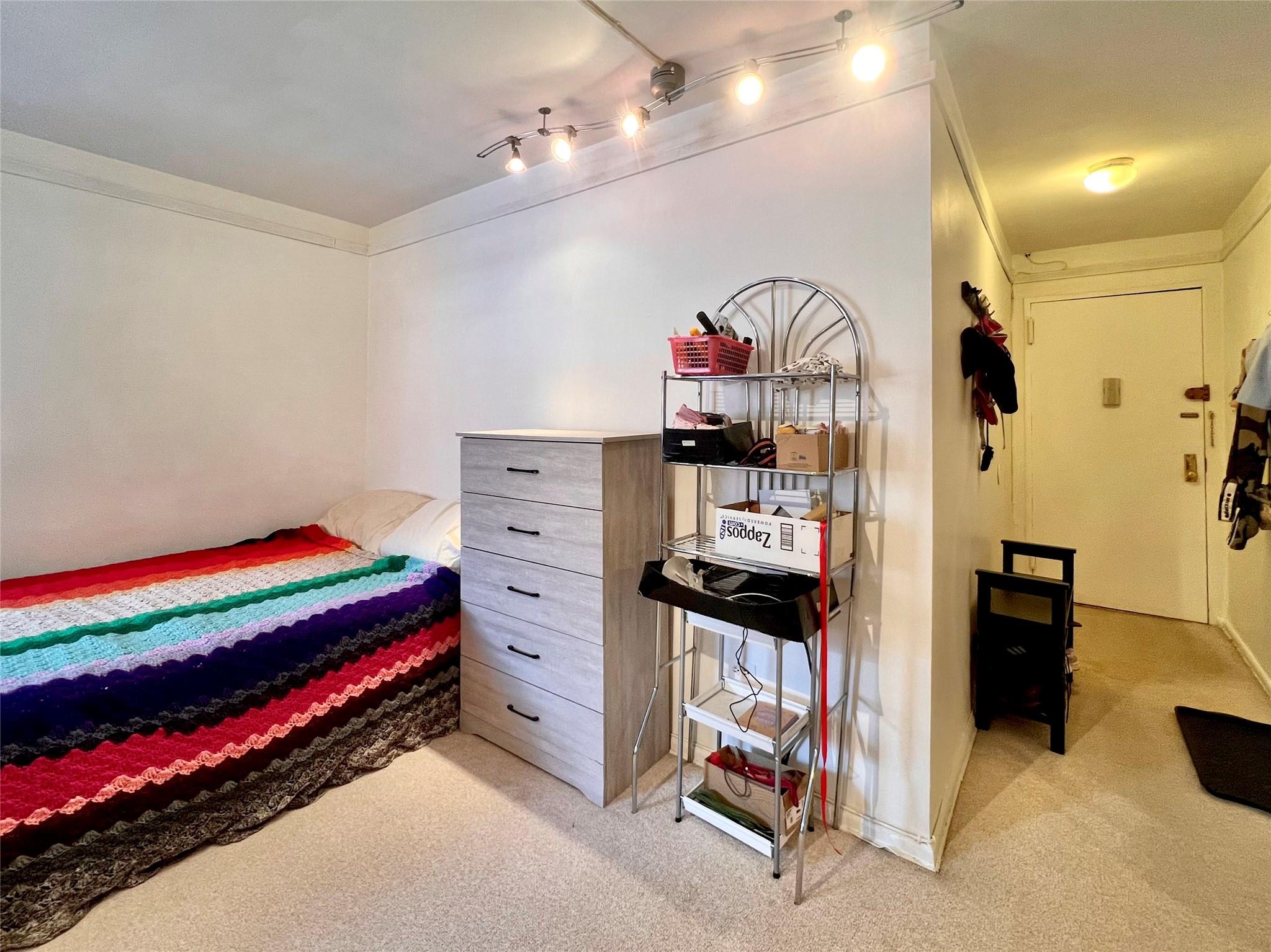 142-05 Roosevelt Avenue, Unit 301 Queens, NY 11354 - Photo 3 of 11 a view of bedroom with furniture