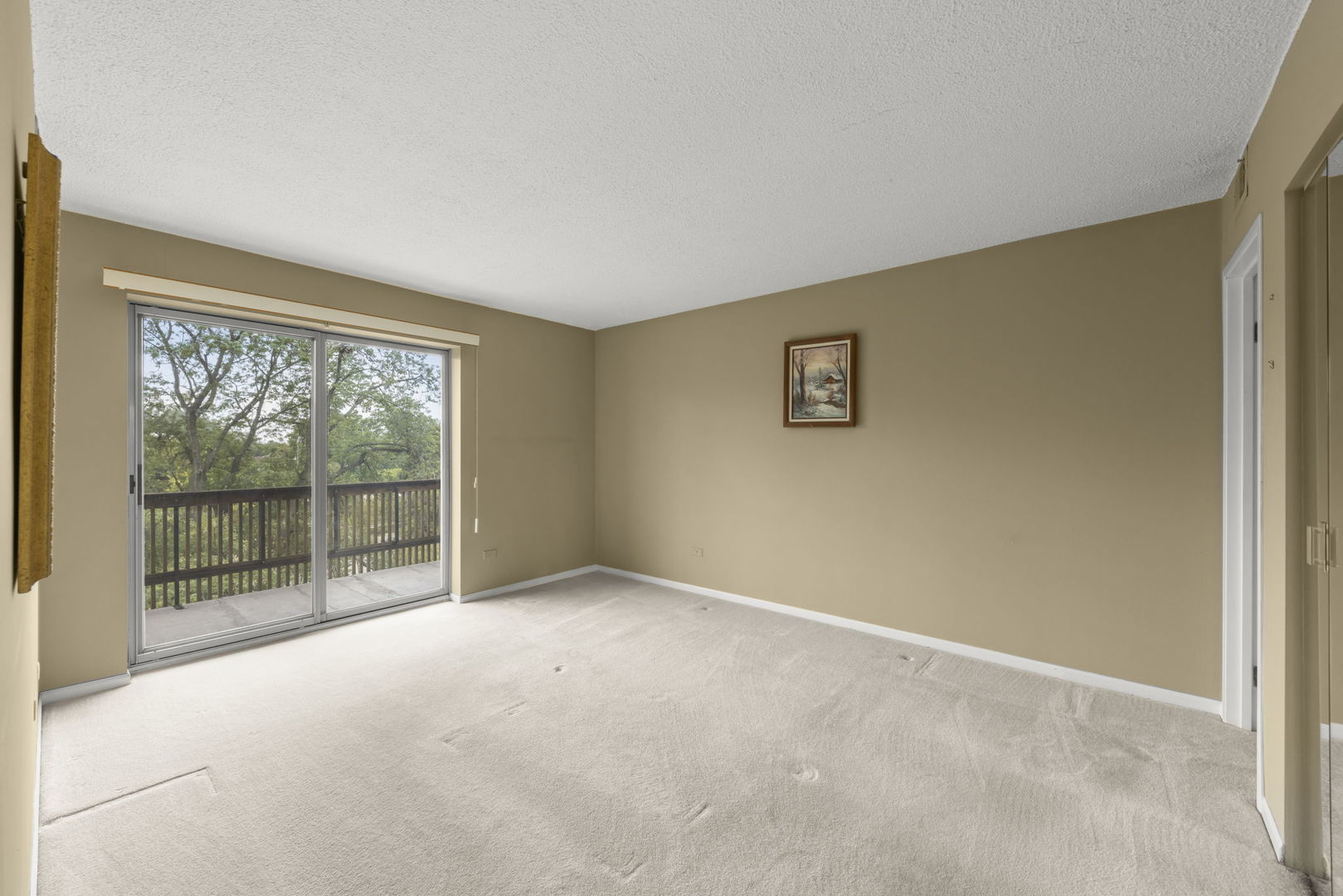 500 Redondo Drive, Unit 409 Downers Grove, IL 60516 - Photo 11 of 18 a view of an empty room with wooden floor and a window