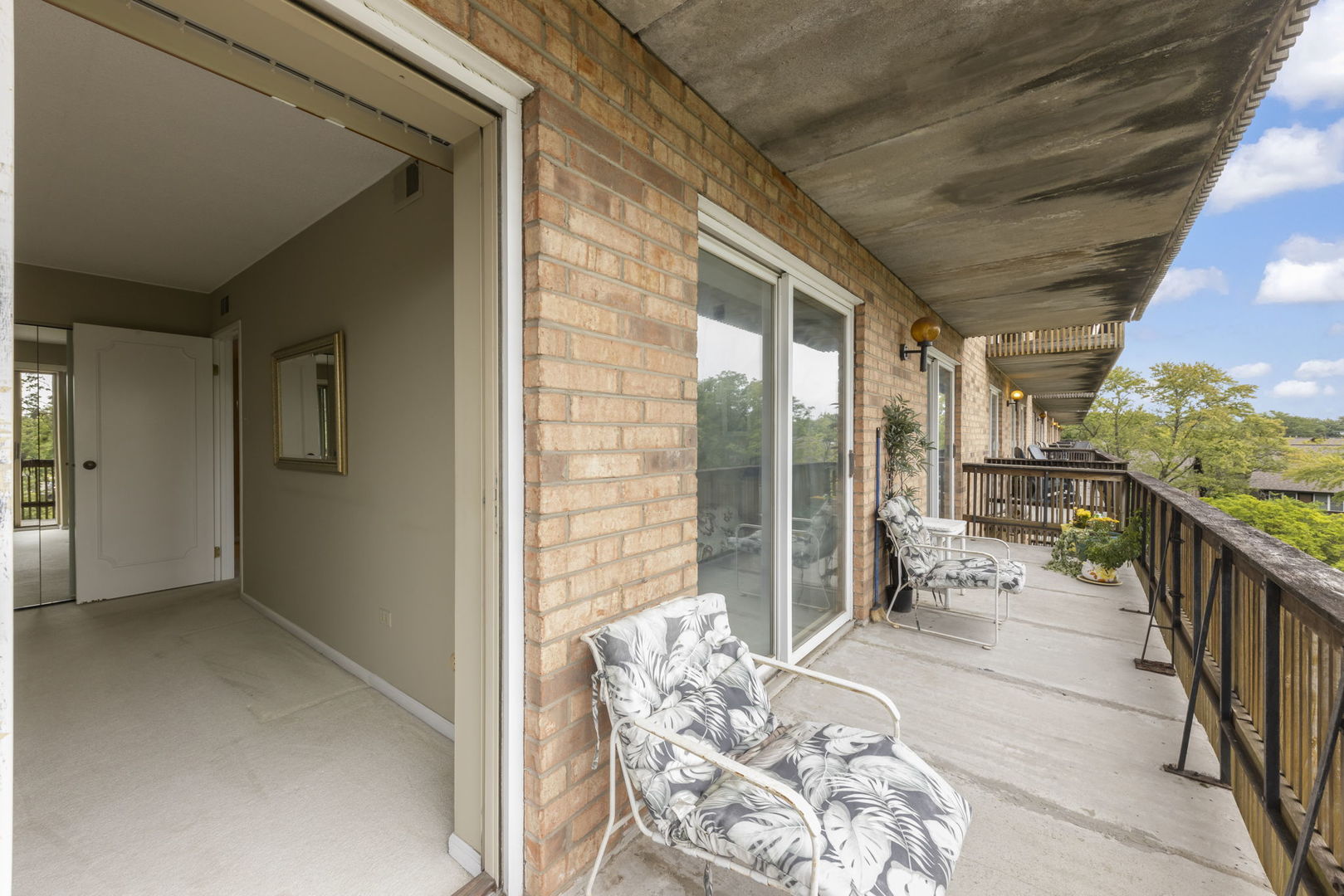 500 Redondo Drive, Unit 409 Downers Grove, IL 60516 - Photo 15 of 18 a balcony with furniture and a gate