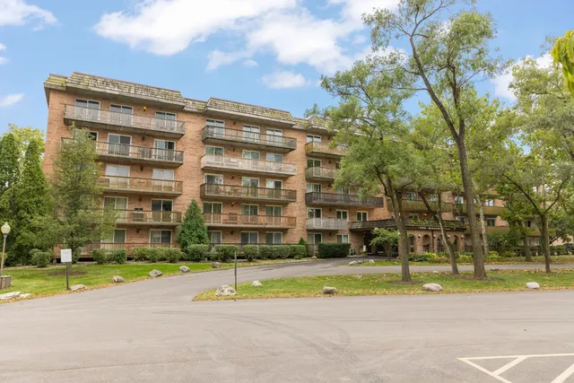 a view of a building with a yard
