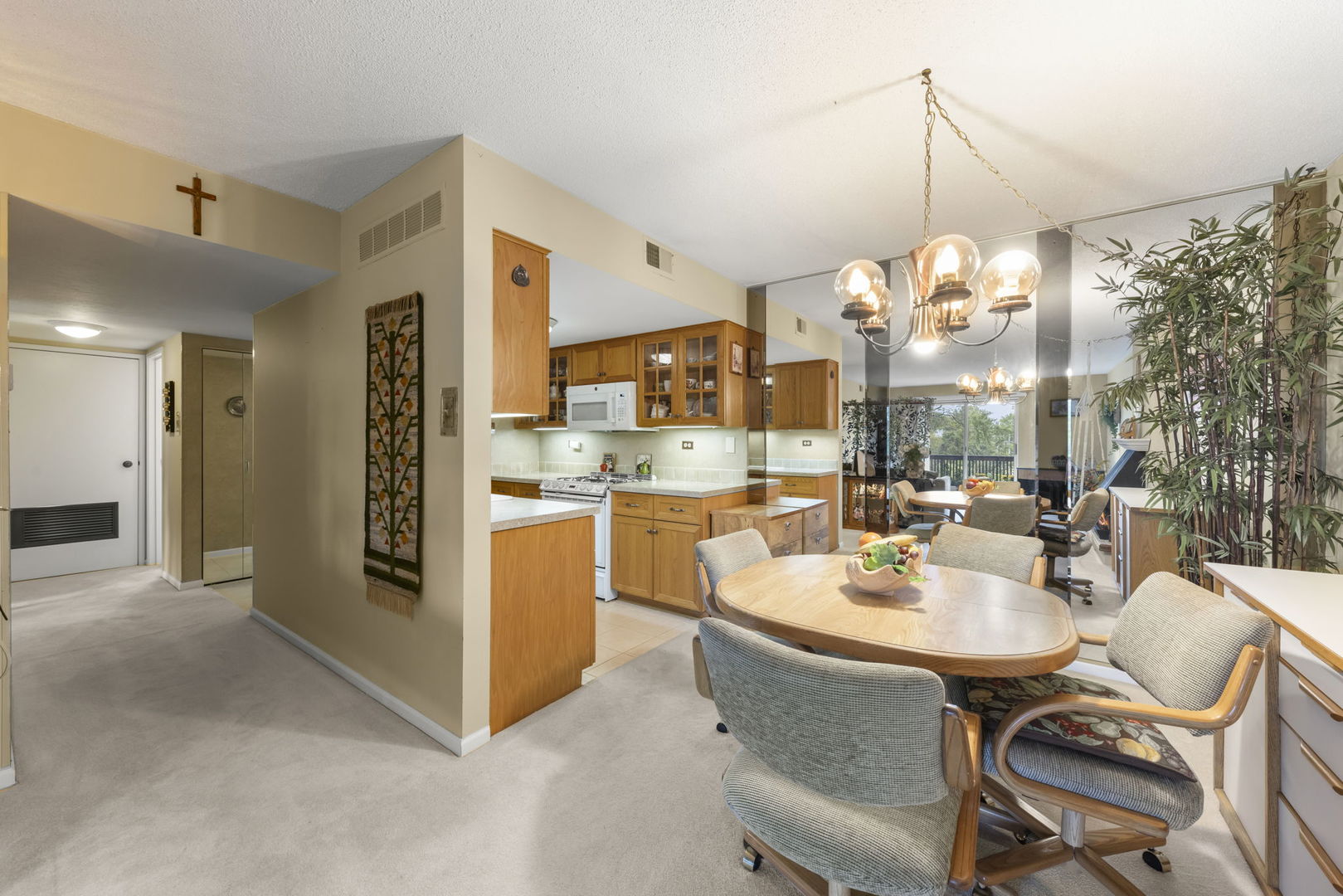 500 Redondo Drive, Unit 409 Downers Grove, IL 60516 - Photo 5 of 18 a very nice looking dining room with kitchen island stainless steel appliances a table and chairs