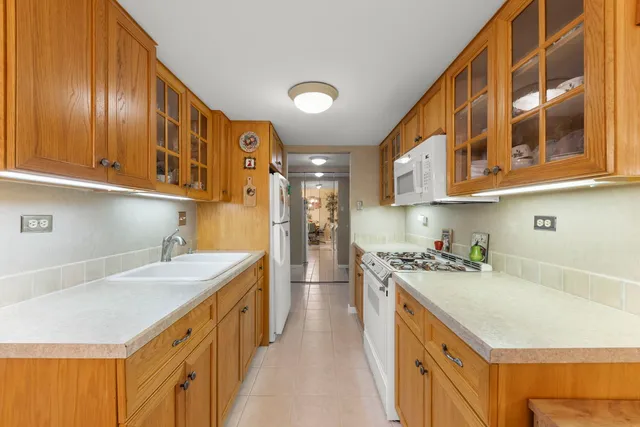 a kitchen with stainless steel appliances granite countertop a sink and cabinets