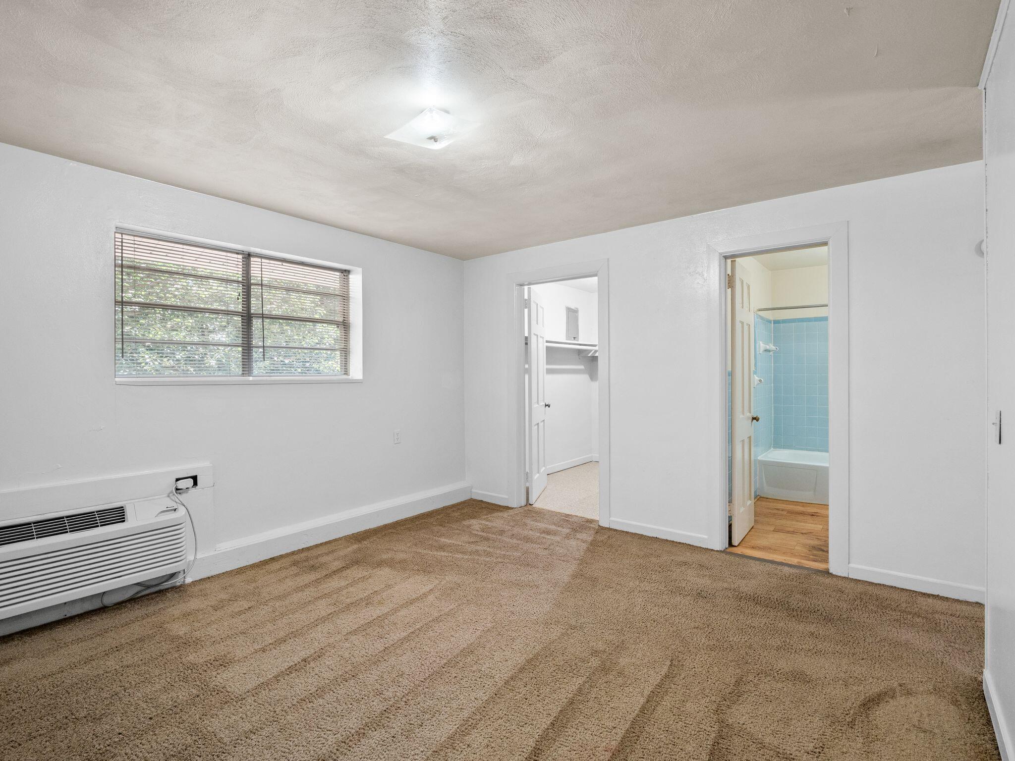 100 Ridgeview Lane, Unit 25 Bassett, VA 24055 - Photo 10 of 23 a view of an empty room with a window