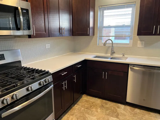a kitchen with a sink and cabinets