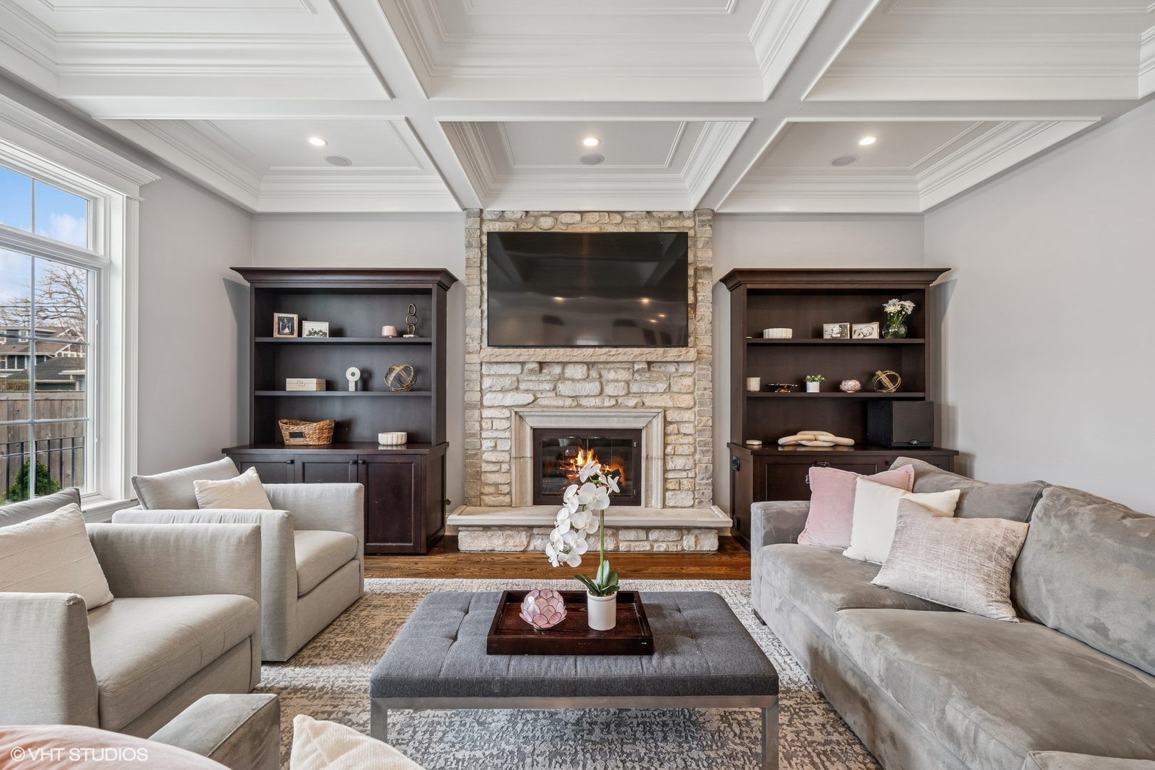 218 10th Street Wilmette, IL 60091 - Photo 11 of 45 a living room with furniture a flat screen tv and a fireplace