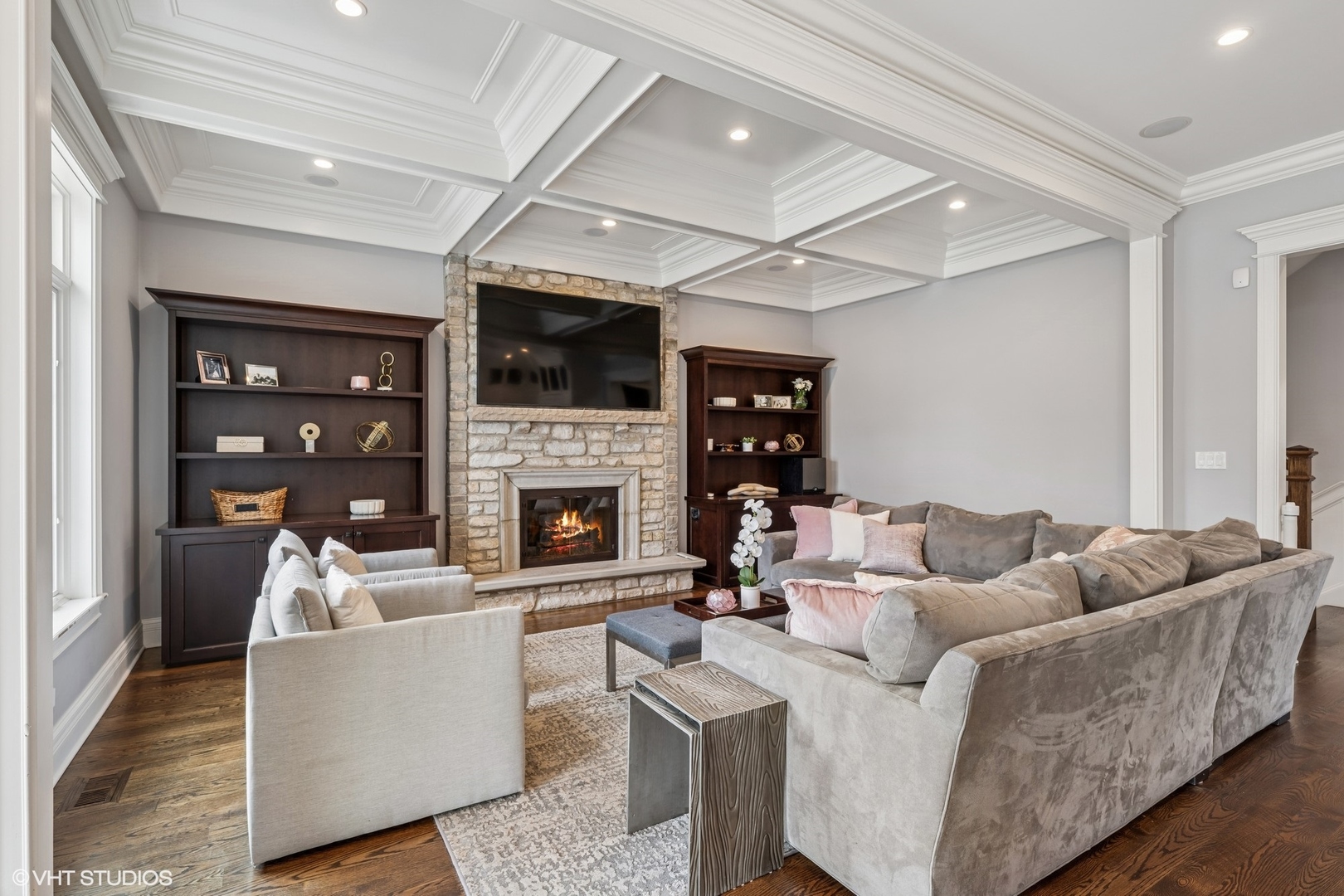 218 10th Street Wilmette, IL 60091 - Photo 12 of 45 a living room with furniture a flat screen tv and a fireplace