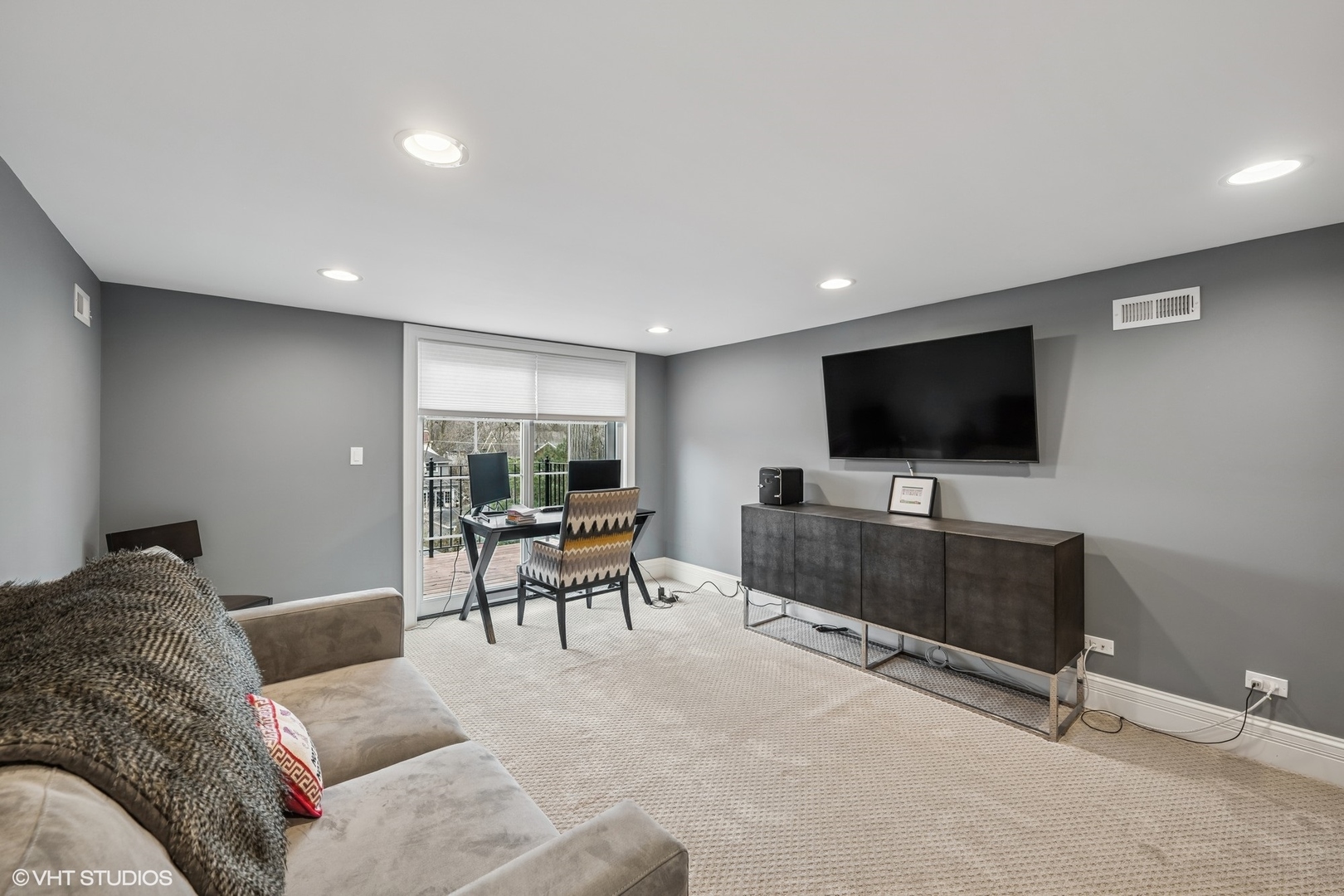 218 10th Street Wilmette, IL 60091 - Photo 25 of 45 a living room with furniture and a flat screen tv