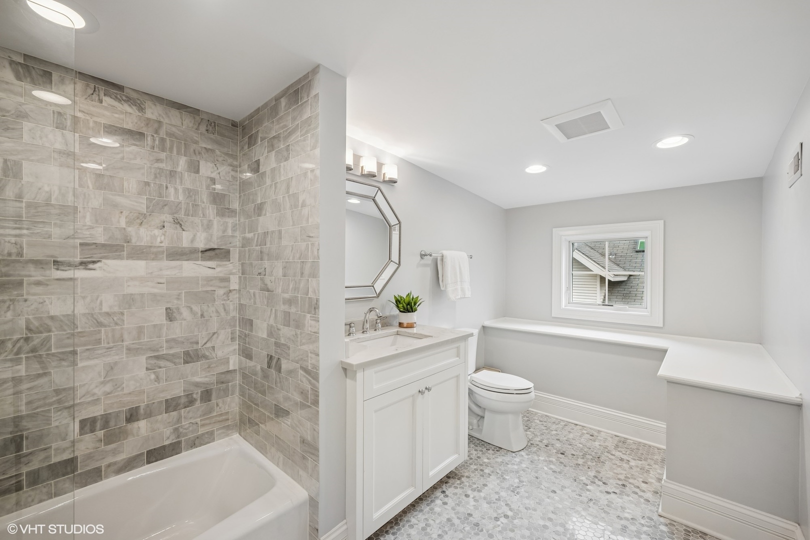 218 10th Street Wilmette, IL 60091 - Photo 27 of 45 a bathroom with a bathtub sink mirror vanity and toilet
