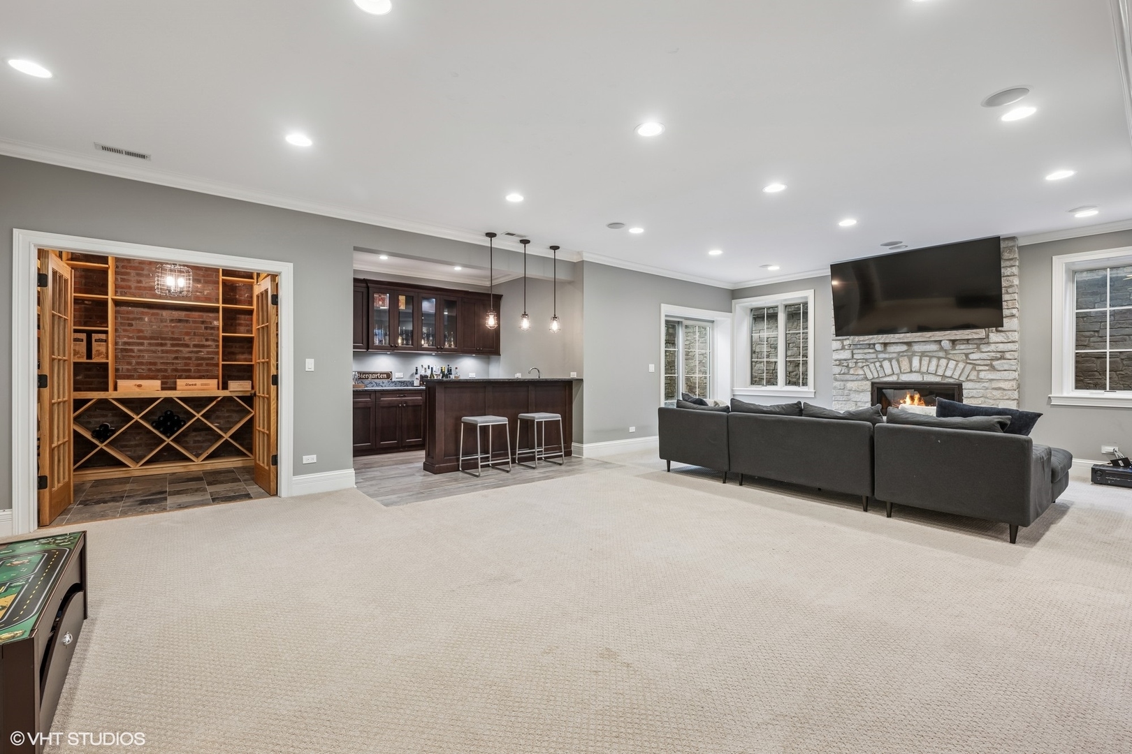 218 10th Street Wilmette, IL 60091 - Photo 28 of 45 a living room with furniture a table and kitchen view
