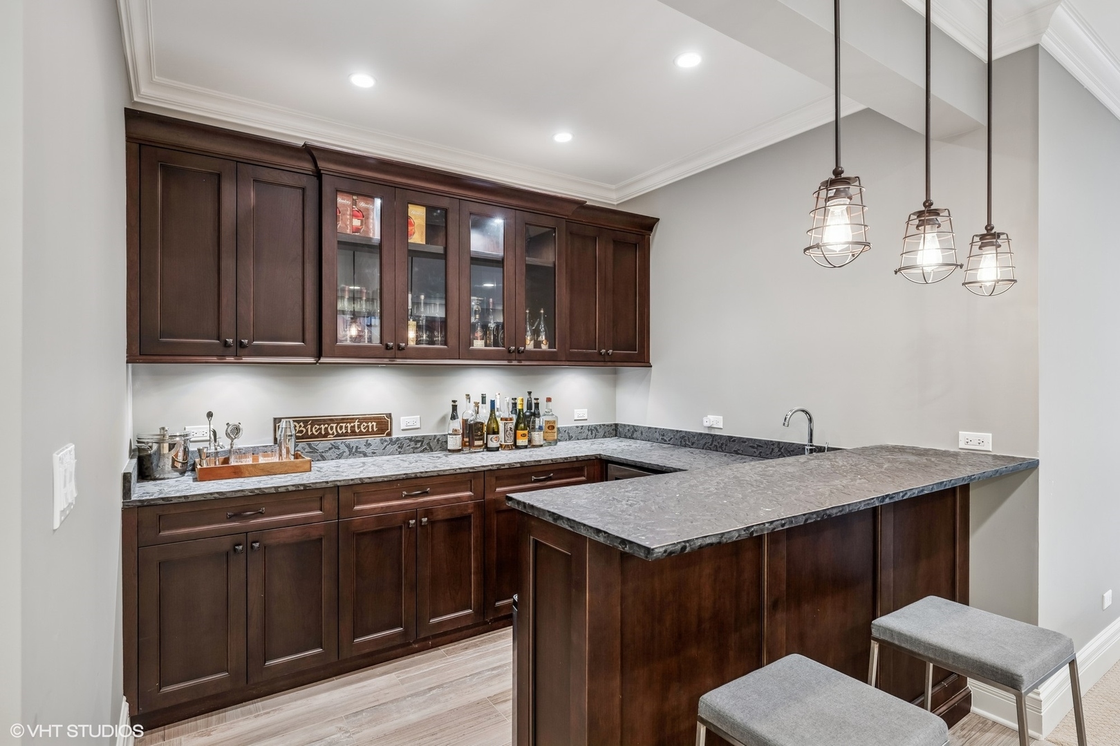 218 10th Street Wilmette, IL 60091 - Photo 32 of 45 a kitchen with a stove a sink a kitchen island with wooden cabinets and floor