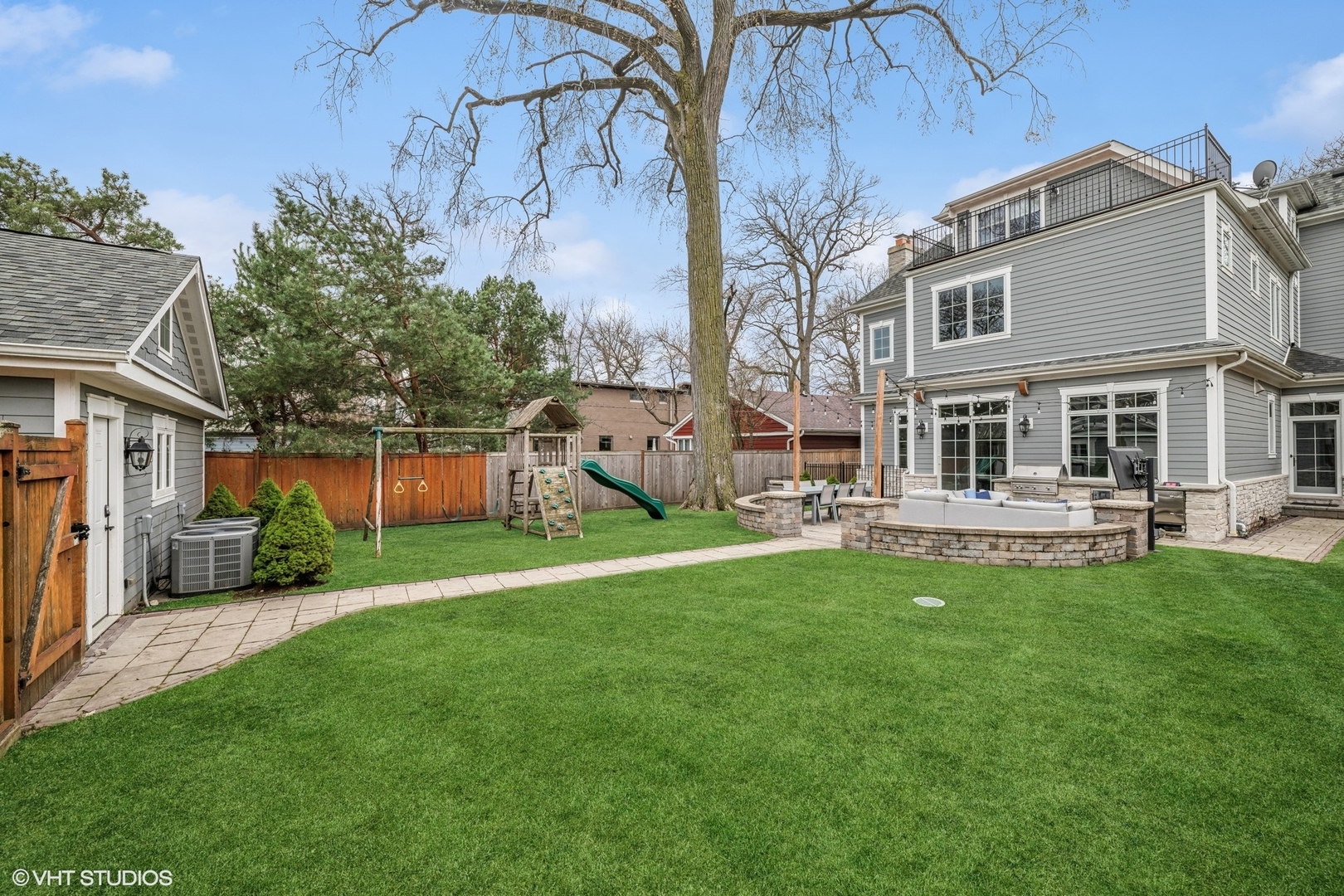 218 10th Street Wilmette, IL 60091 - Photo 38 of 45 a backyard of a house with table and chairs
