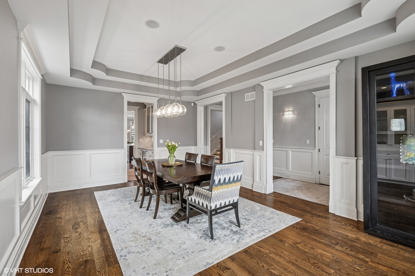 218 10th Street Wilmette, IL 60091 - Photo 4 of 45 a view of a dining room with furniture and wooden floor
