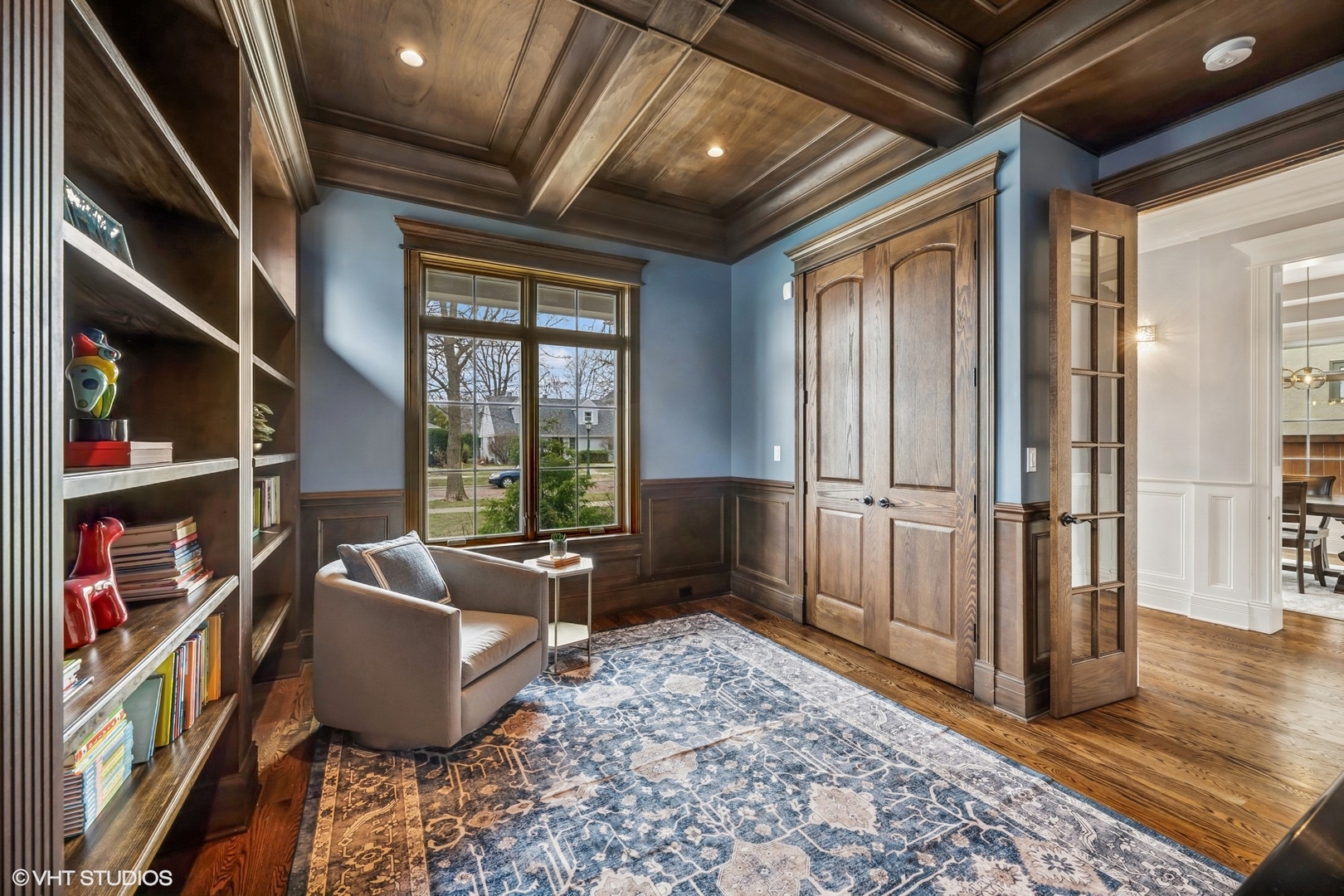 218 10th Street Wilmette, IL 60091 - Photo 5 of 45 a living room with furniture a rug and a book shelf
