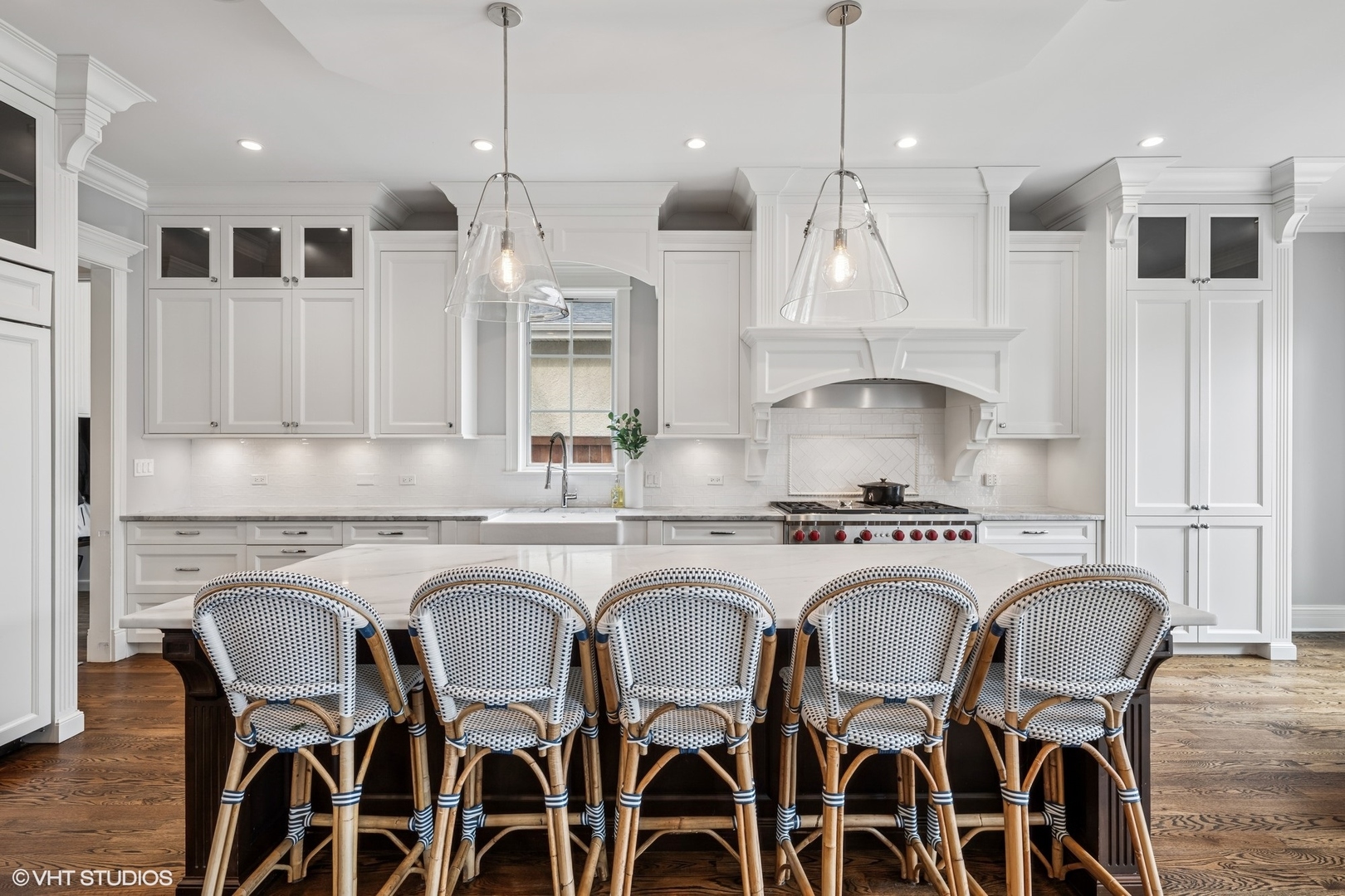 218 10th Street Wilmette, IL 60091 - Photo 7 of 45 a kitchen with stainless steel appliances granite countertop a dining table chairs refrigerator and microwave