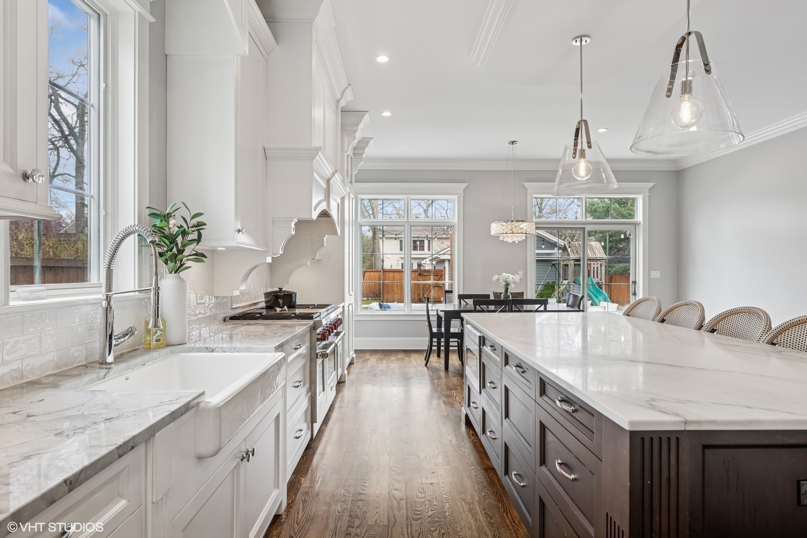 218 10th Street Wilmette, IL 60091 - Photo 9 of 45 a large kitchen with granite countertop a sink a counter space appliances and cabinets