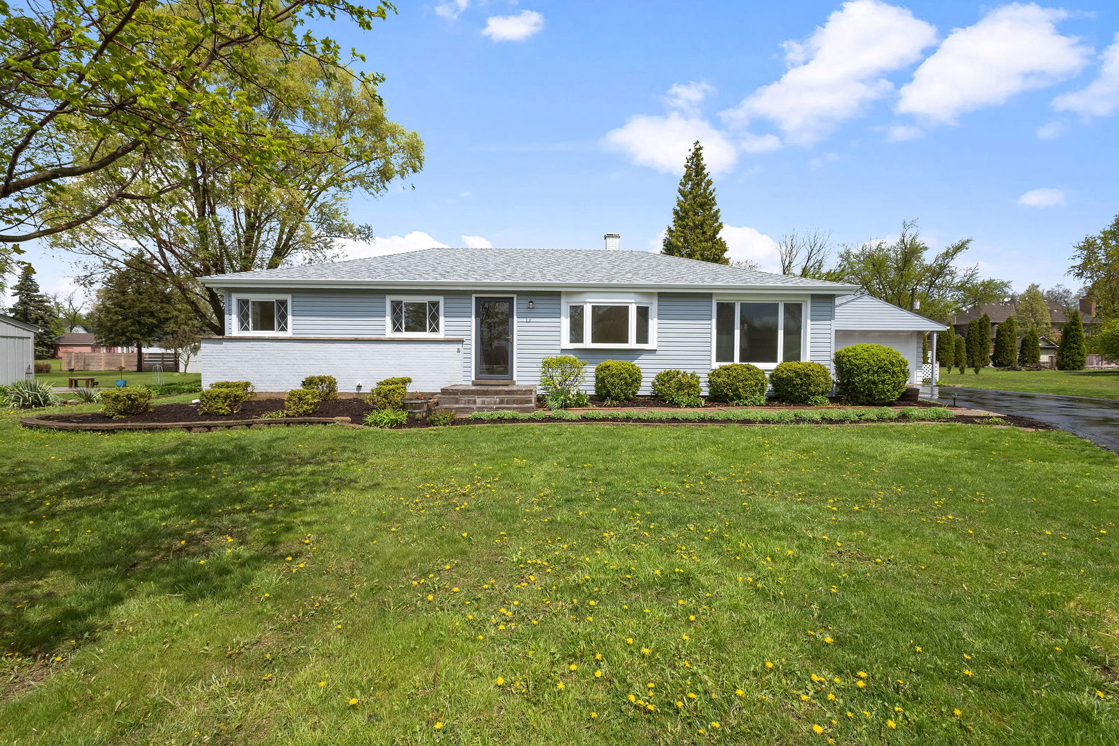 646 68th Street Willowbrook, IL 60527 - Photo 1 of 24 a front view of house with yard and green space