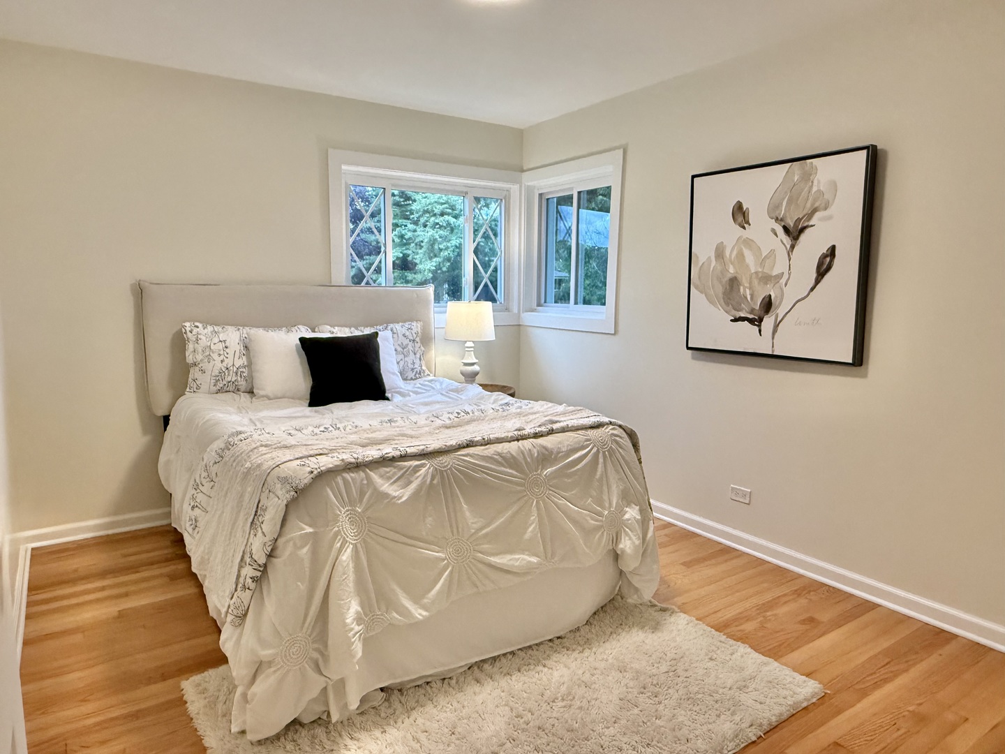 646 68th Street Willowbrook, IL 60527 - Photo 14 of 24 a bed sitting in a bedroom next to a window