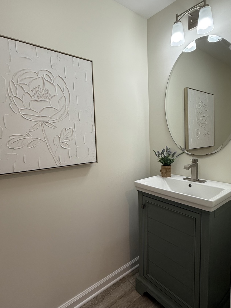 646 68th Street Willowbrook, IL 60527 - Photo 6 of 24 a bathroom with a sink and mirror