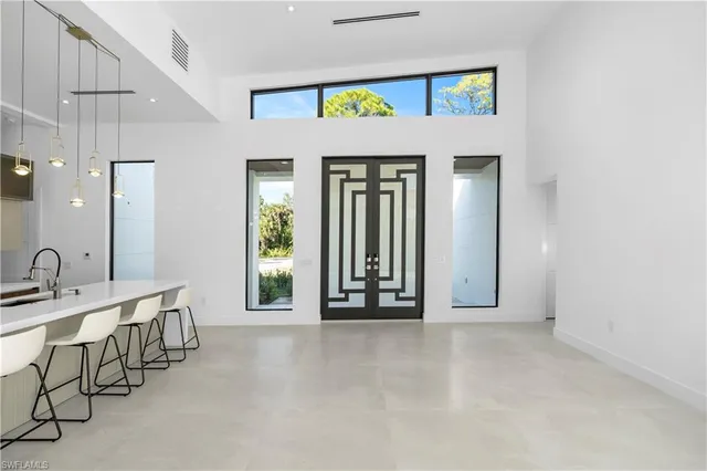 a bathroom with a double vanity sink a mirror and a shower