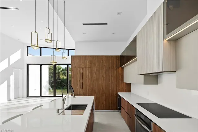 a view of kitchen and utility room with wooden floor