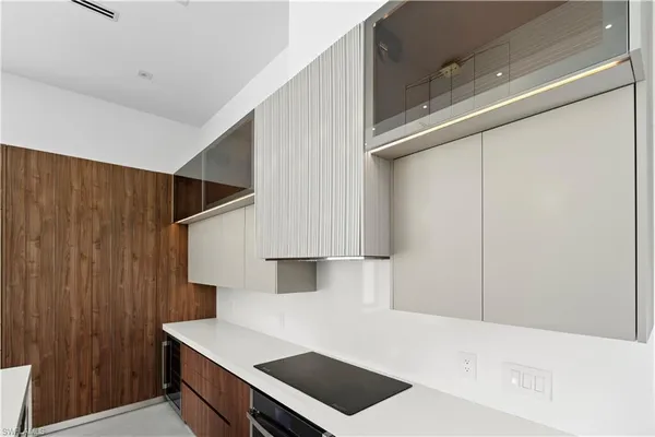 a view of kitchen and utility room with wooden floor