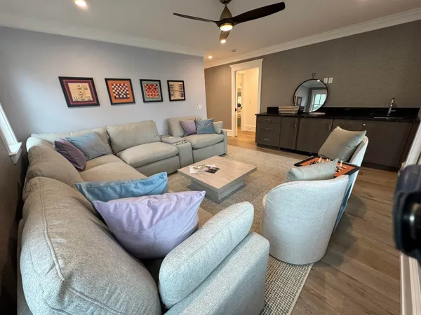 a balcony with furniture and wooden floor