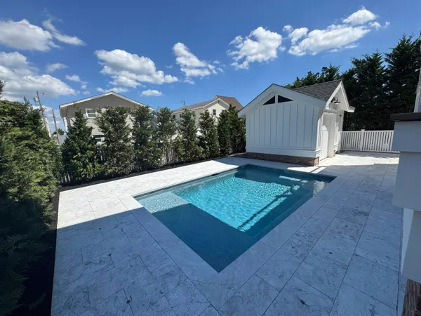 a view of a pathway of a house with backyard and deck