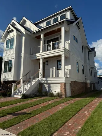 a bathroom with a double vanity sink toilet and shower