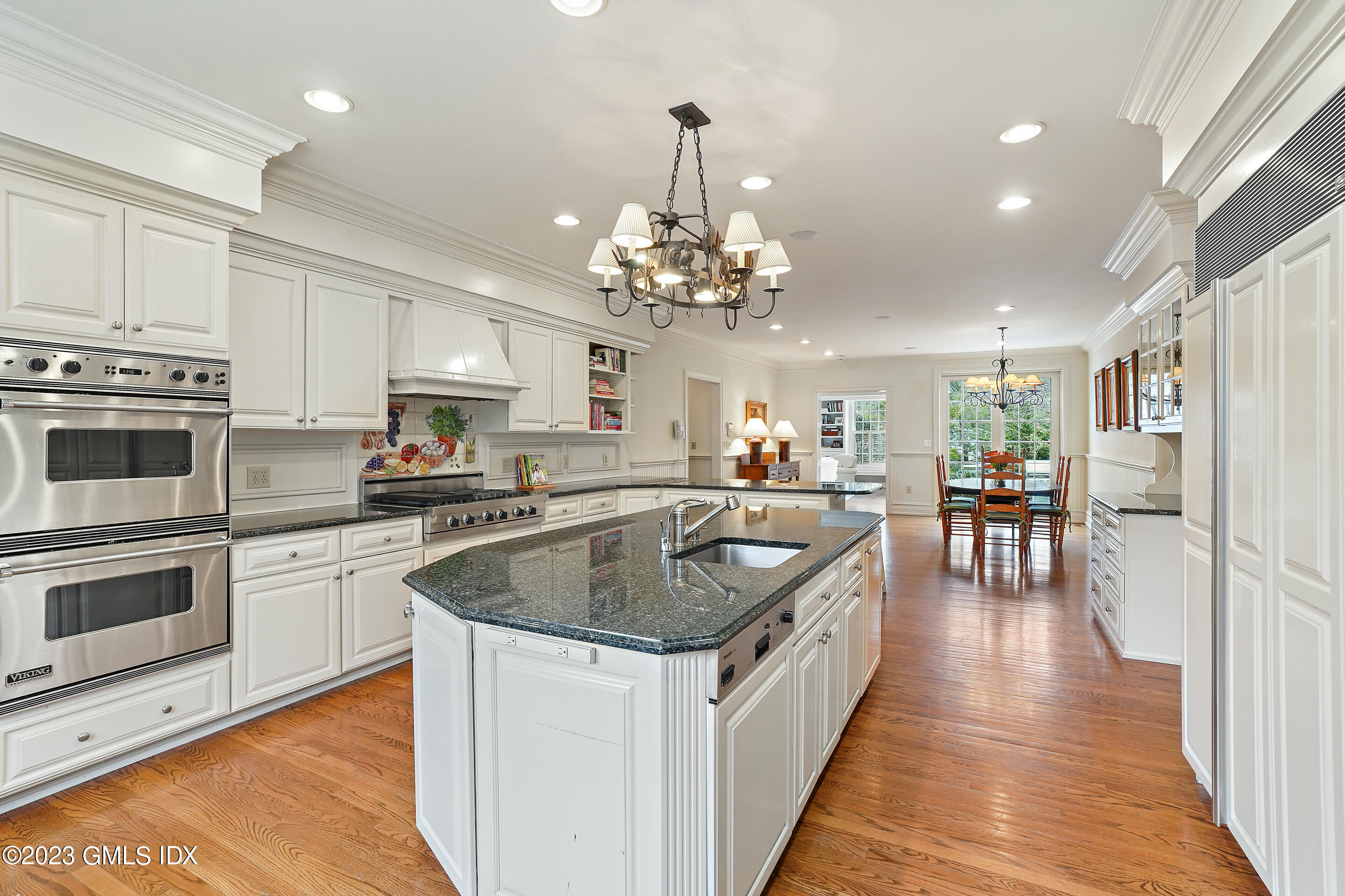 55 North Street Greenwich, CT 06830 - Photo 11 of 44 a kitchen with stove and cabinets