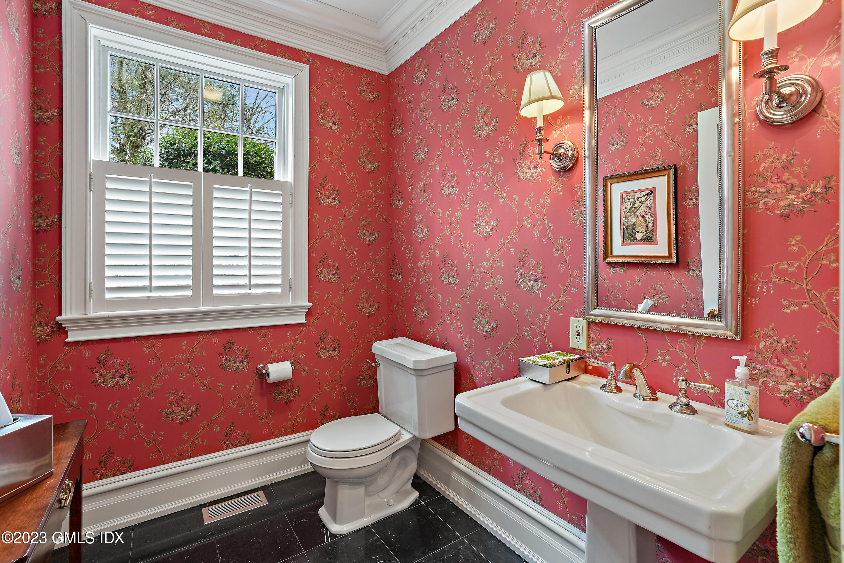 55 North Street Greenwich, CT 06830 - Photo 15 of 44 a bathroom with a sink a toilet and a window