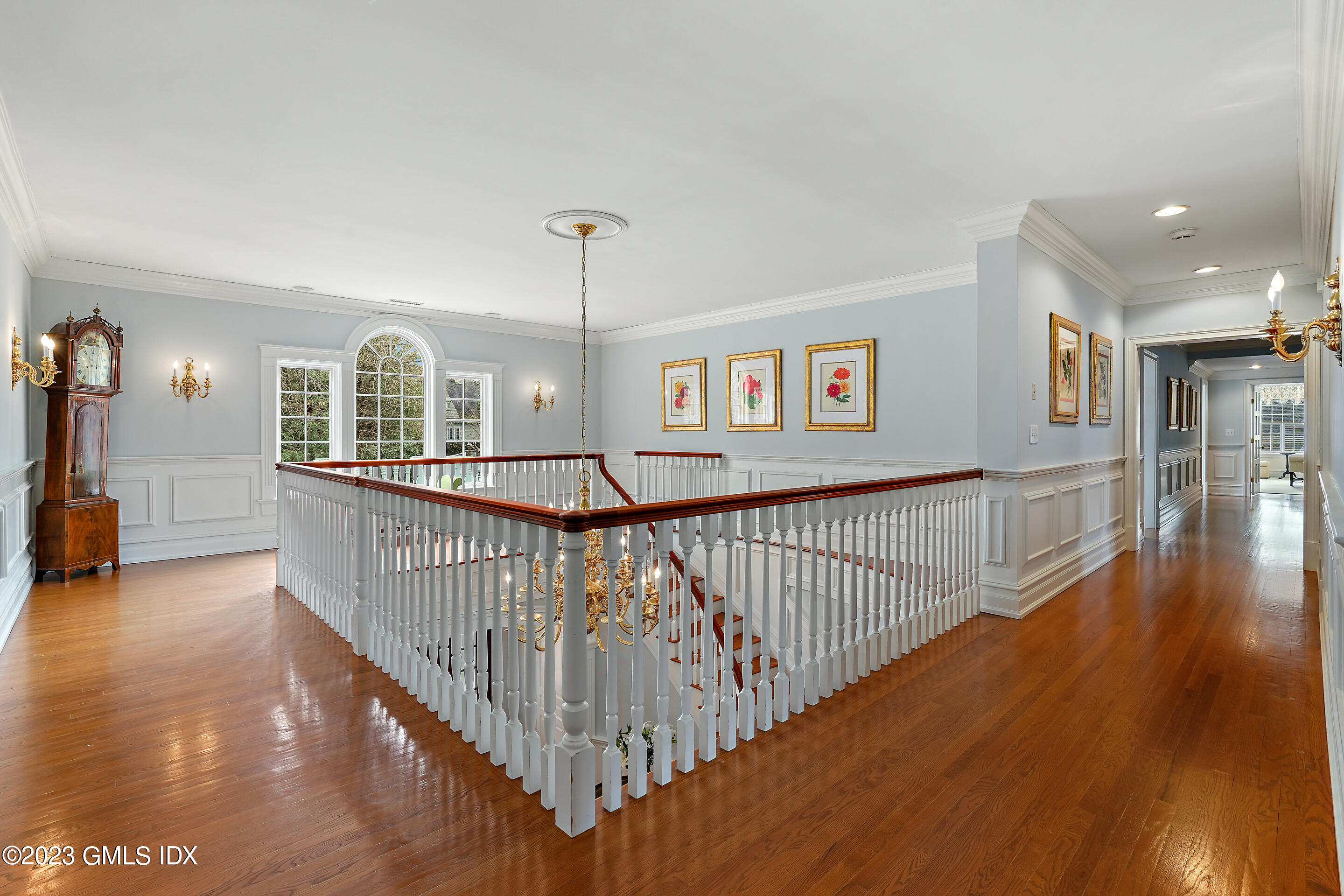 55 North Street Greenwich, CT 06830 - Photo 17 of 44 a view of a hallway with wooden floor and stairs