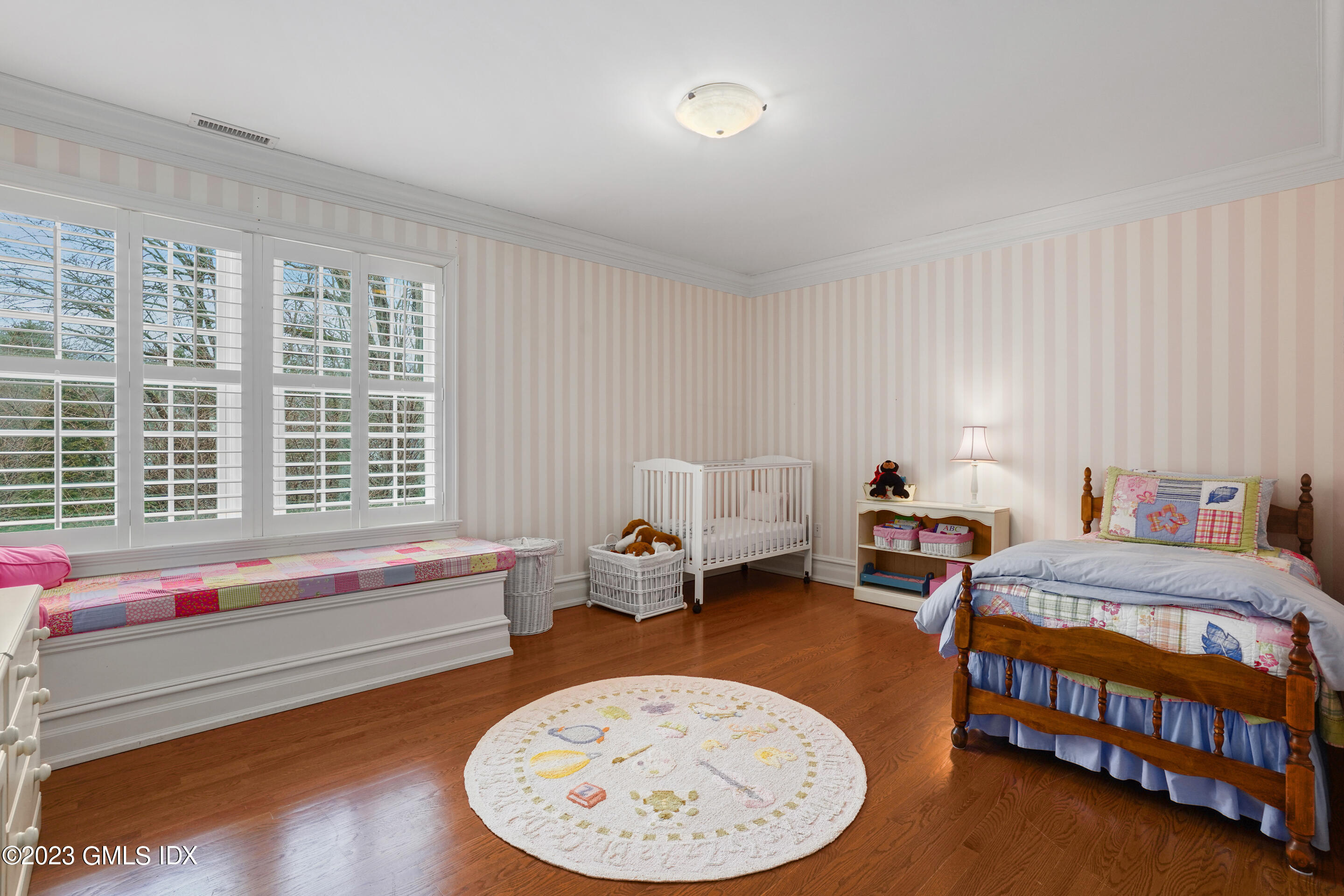 55 North Street Greenwich, CT 06830 - Photo 22 of 44 a bedroom with bed and a window