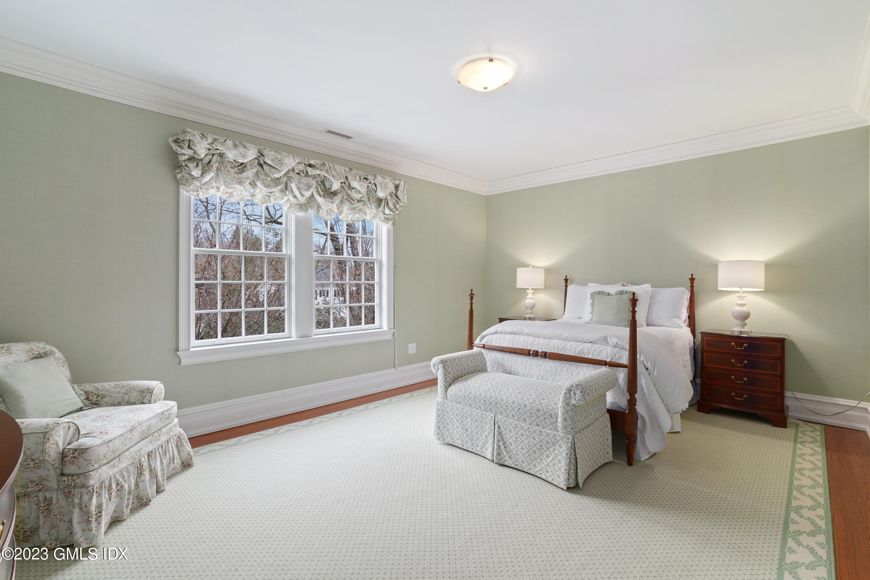 55 North Street Greenwich, CT 06830 - Photo 24 of 44 a spacious bedroom with a bed and a couch