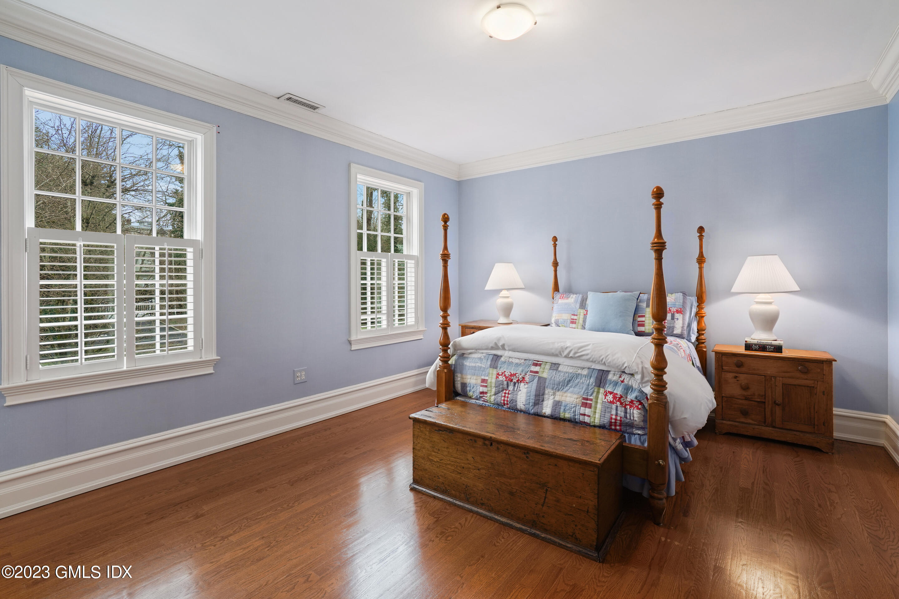 55 North Street Greenwich, CT 06830 - Photo 25 of 44 a bedroom with bed window and couch