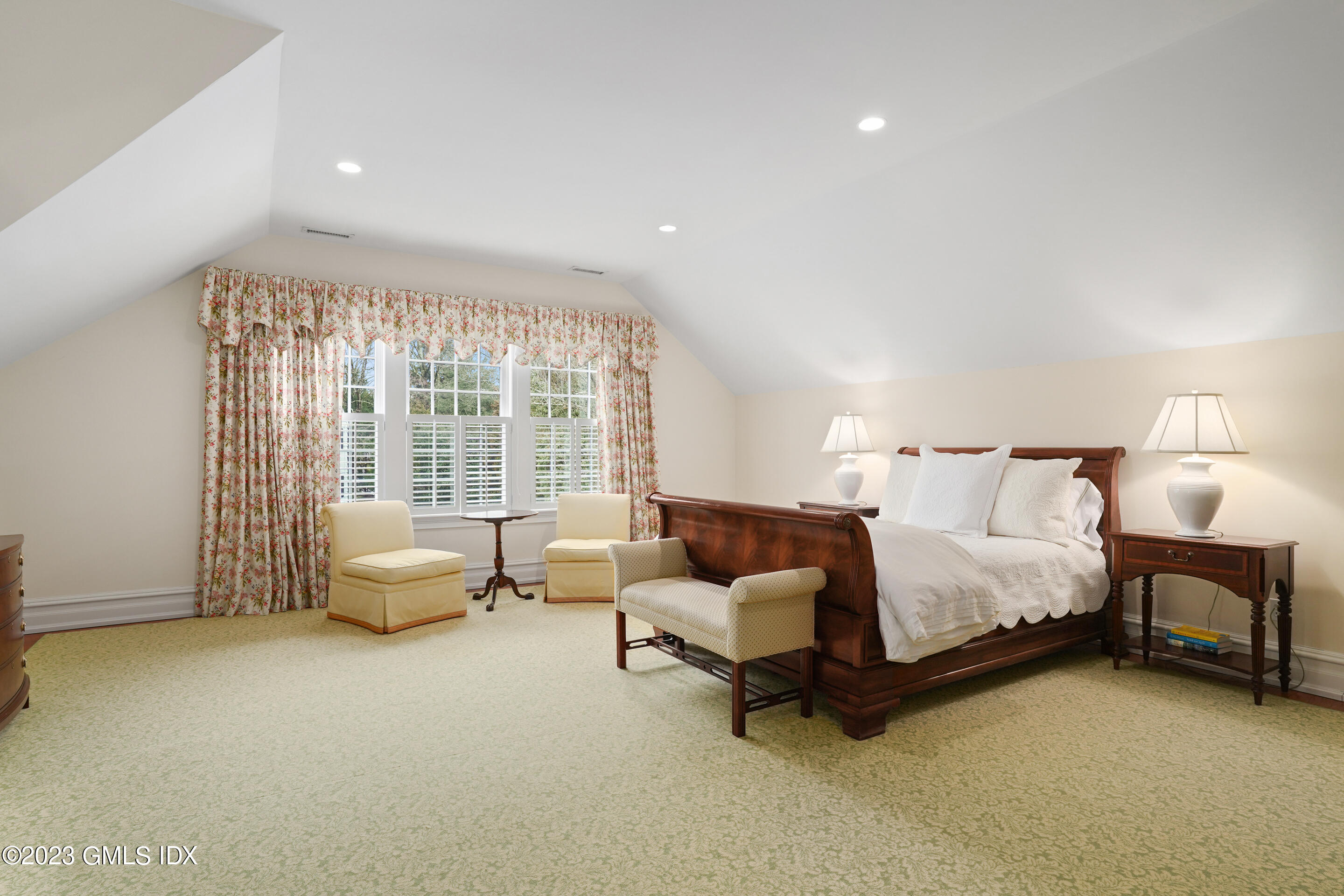 55 North Street Greenwich, CT 06830 - Photo 27 of 44 a spacious bedroom with a bed and a couch