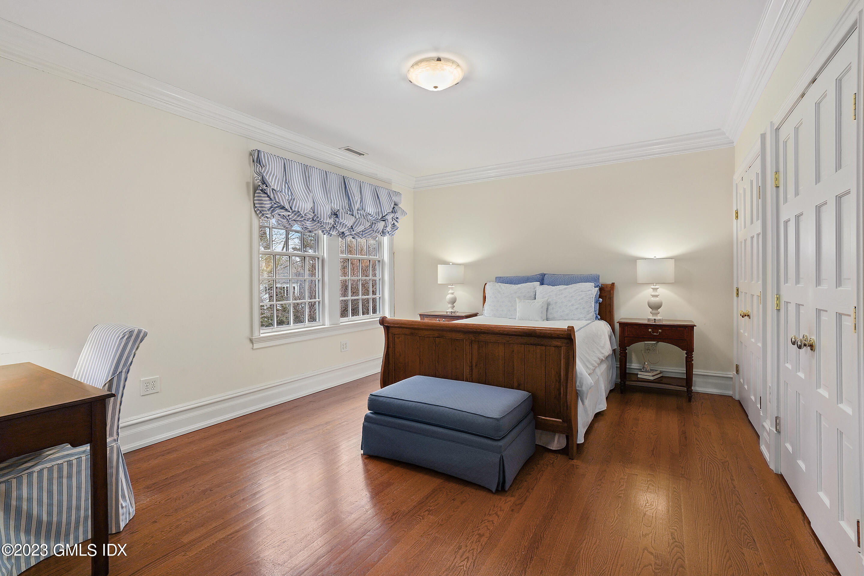 55 North Street Greenwich, CT 06830 - Photo 29 of 44 a bedroom with furniture and a window