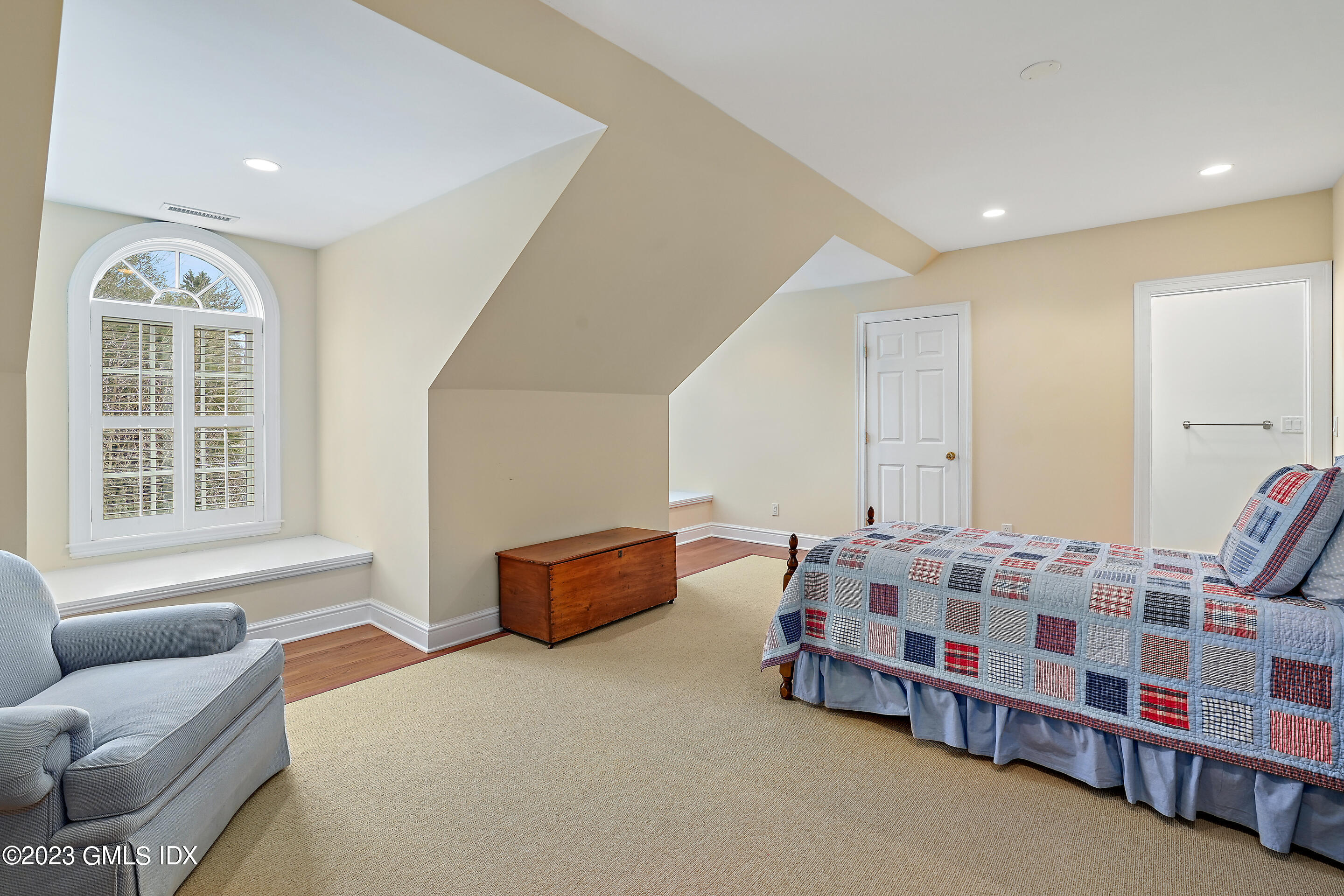 55 North Street Greenwich, CT 06830 - Photo 31 of 44 a bedroom with furniture and window