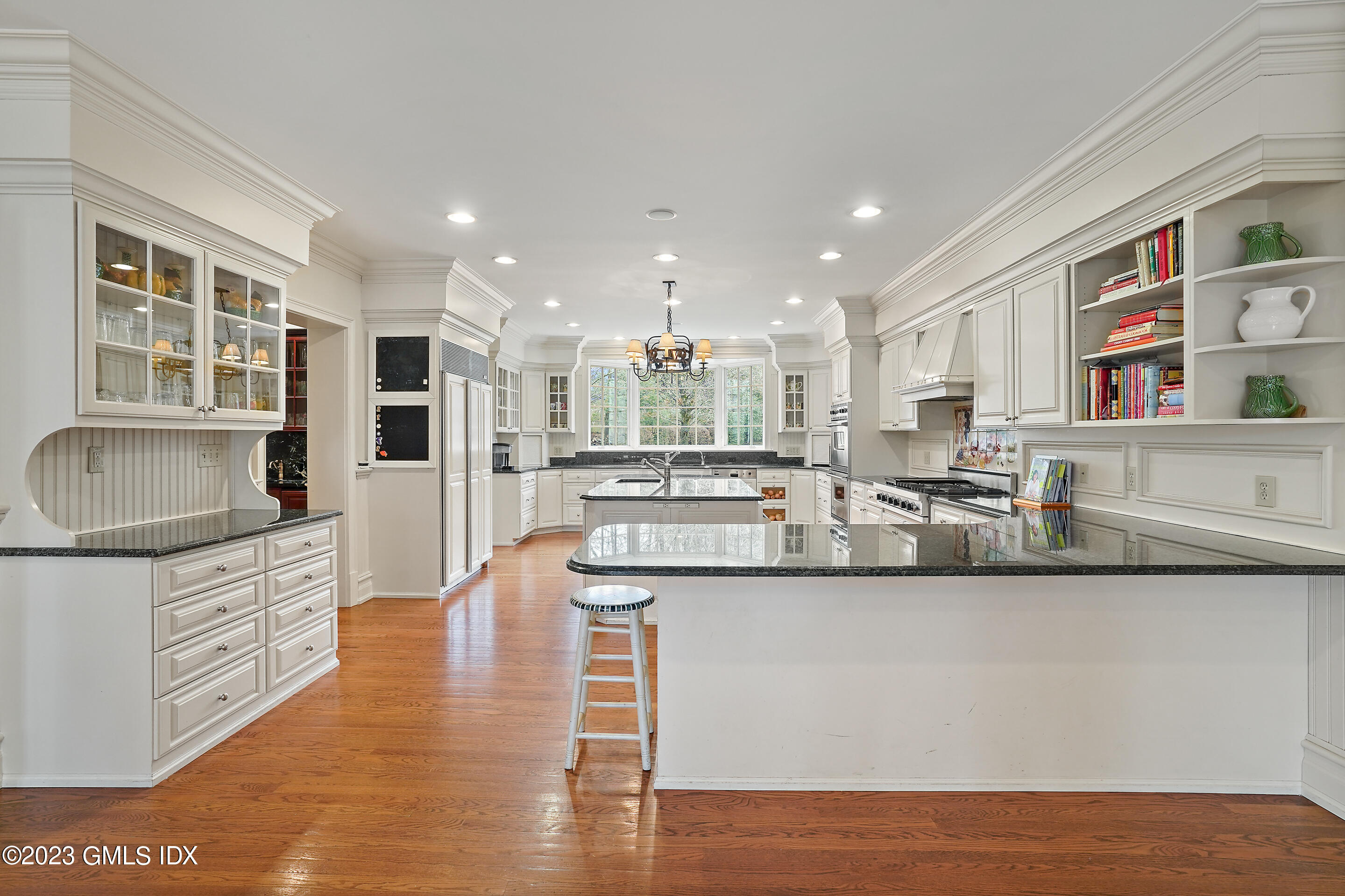 55 North Street Greenwich, CT 06830 - Photo 10 of 44 a kitchen with stainless steel appliances granite countertop a sink stove and cabinets