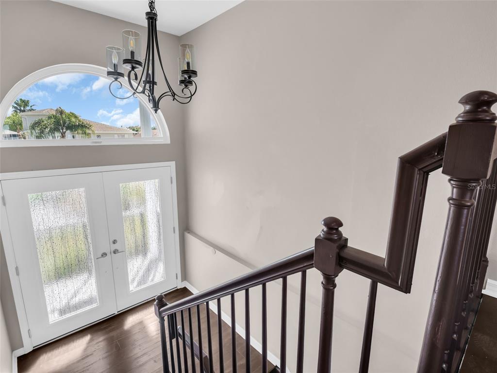 6241 Bayside Drive New Port Richey, FL 34652 - Photo 20 of 78 a view of a room with wooden floor and windows