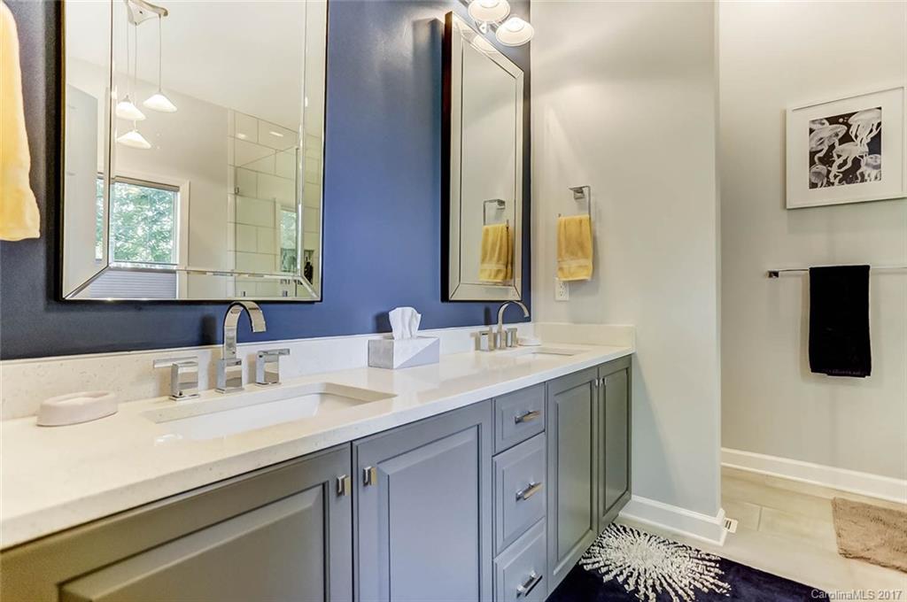 31001 Executive Point Tega Cay, SC 29708 - Photo 13 of 24 a bathroom with a sink and a mirror