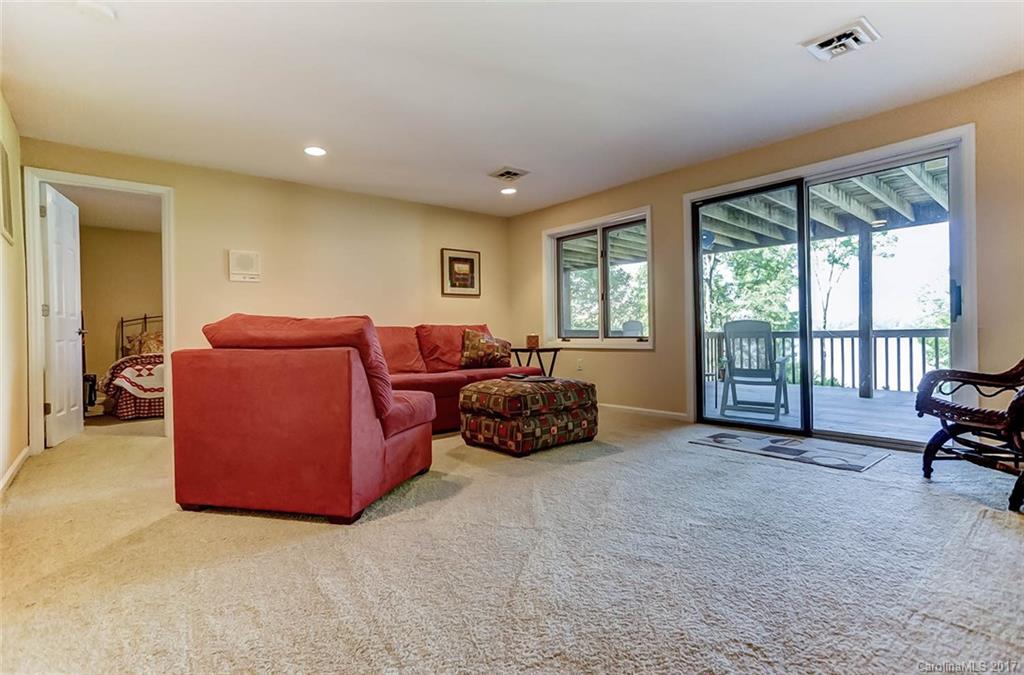 31001 Executive Point Tega Cay, SC 29708 - Photo 17 of 24 a living room with furniture and large windows